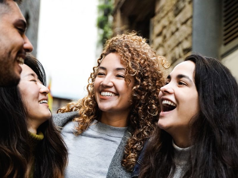 Happy friends from diverse culture and race having fun outdoors. Youth culture and friendship life